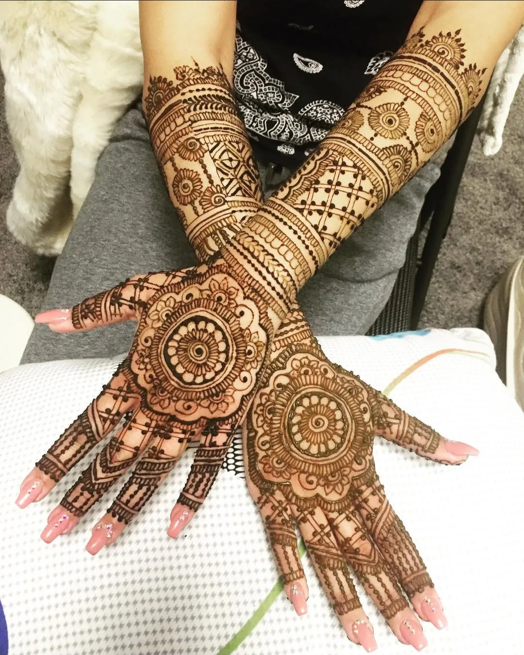 Both hands showing a deep, well-developed henna stain after proper aftercare