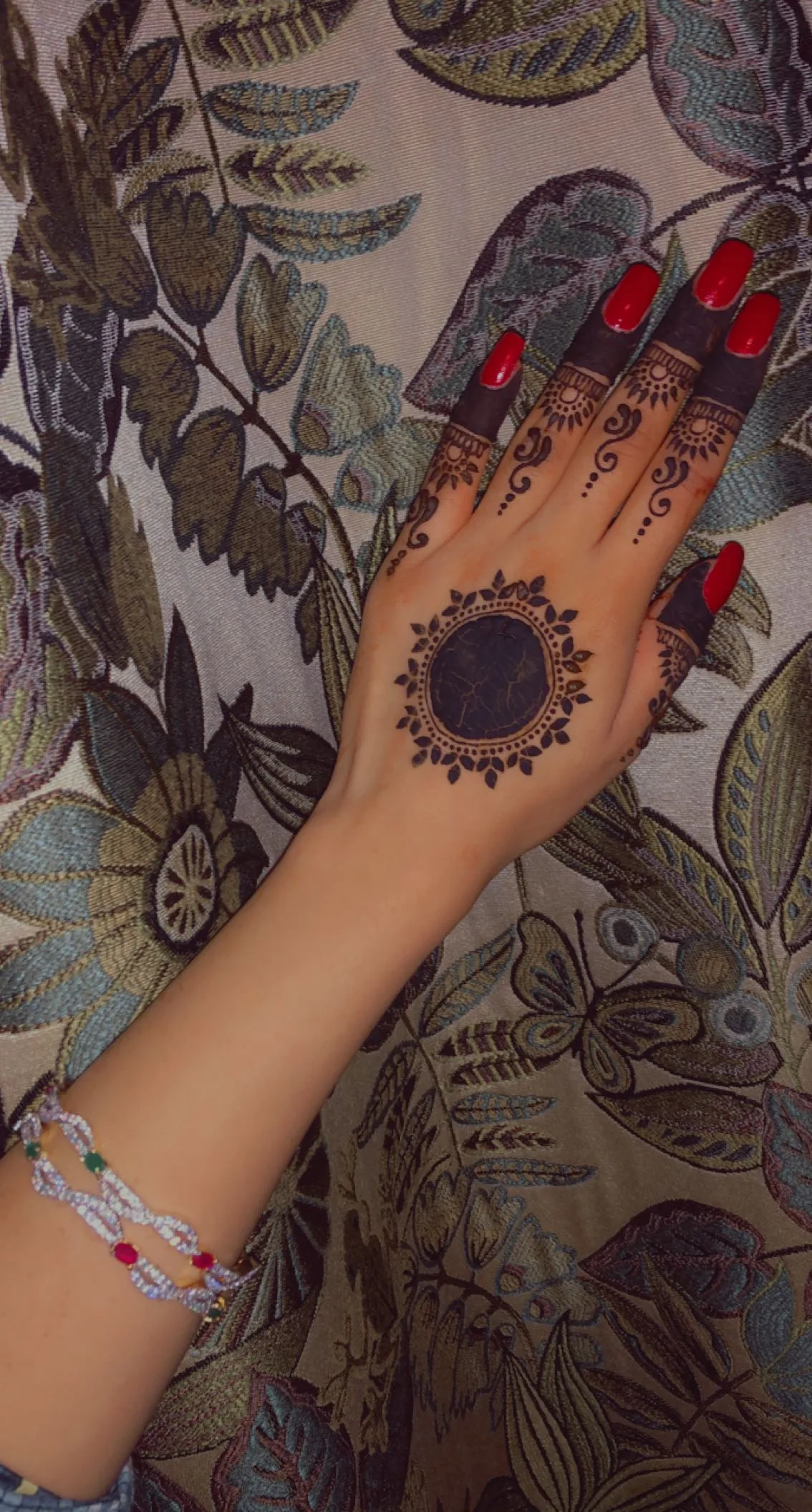 Henna stain softly fading about a week after application
