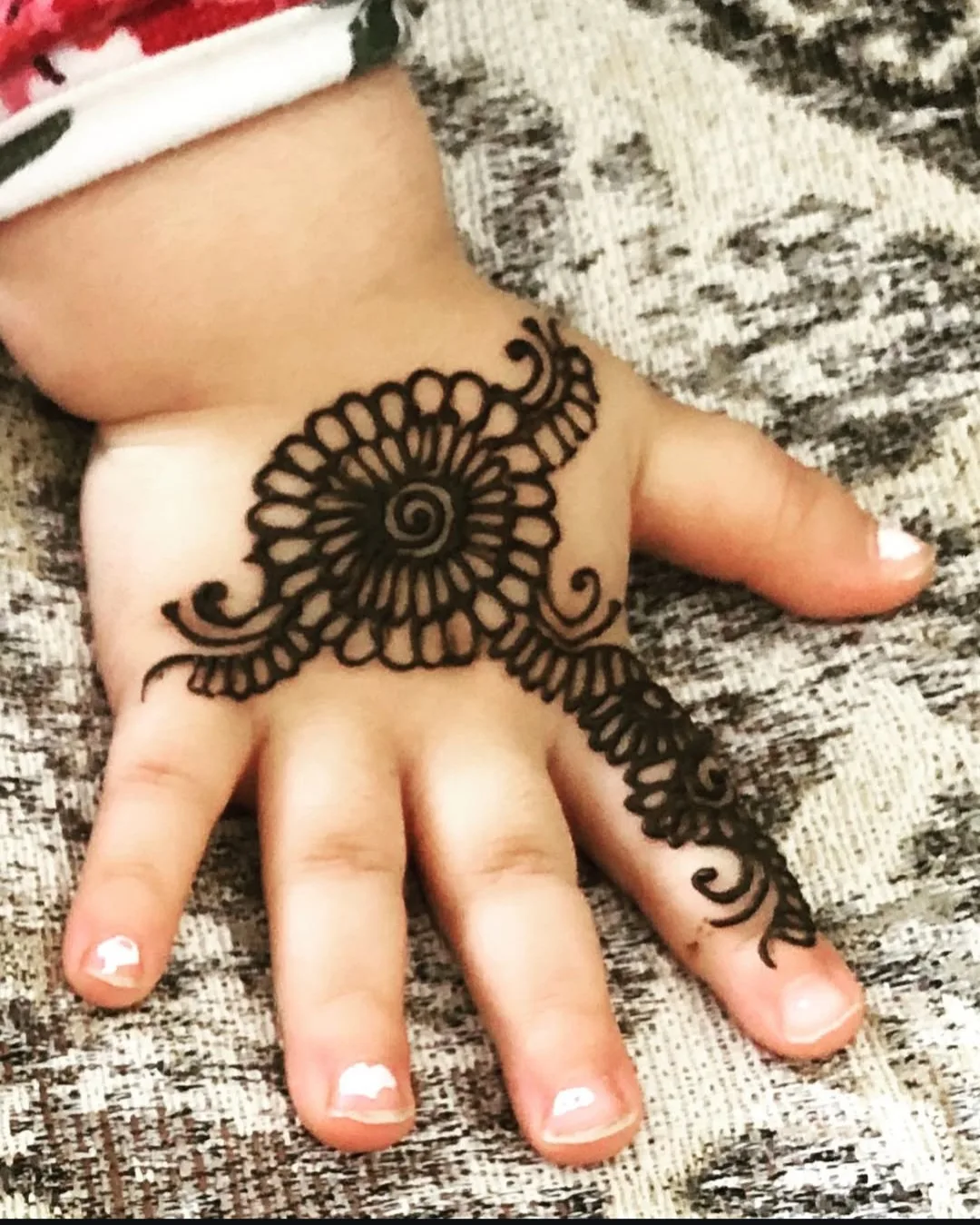 Deep, dark reddish-brown henna stain at peak colour