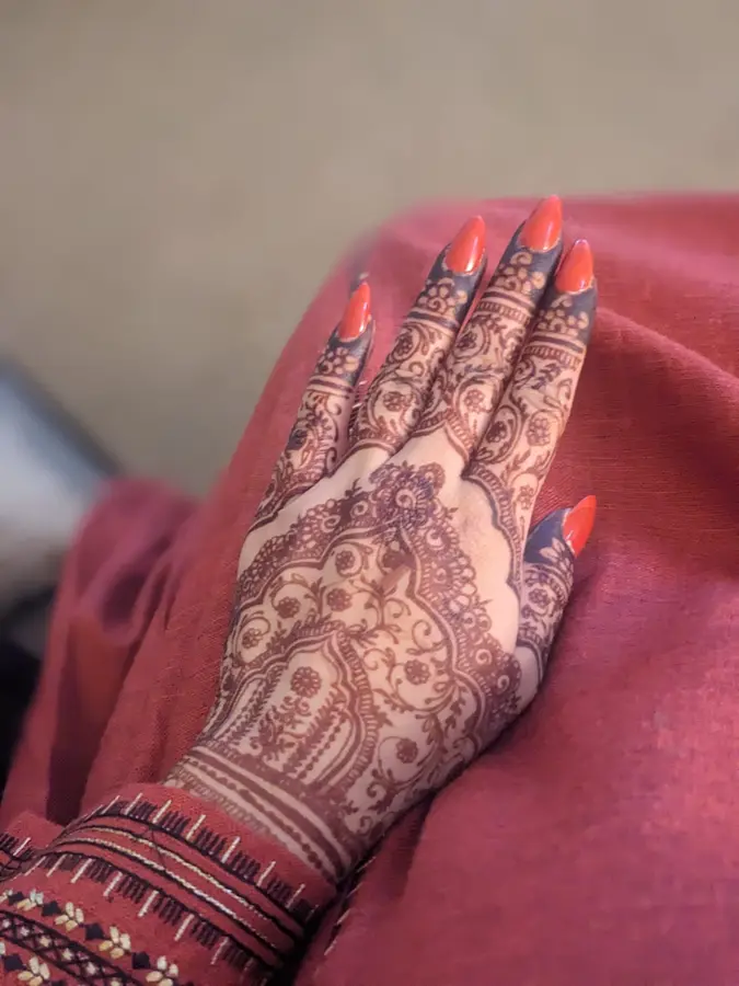Karwa Chauth mehndi design filling the back of the hand and every finger with dense paisley
