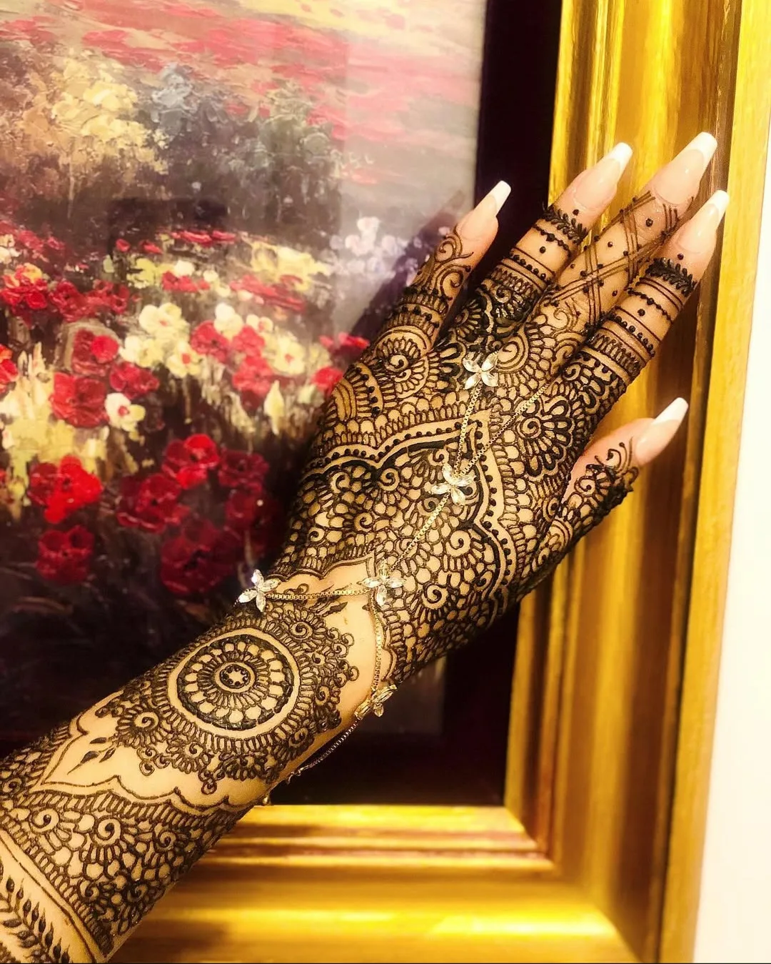 Karva Chauth-style henna on both hands with traditional motifs