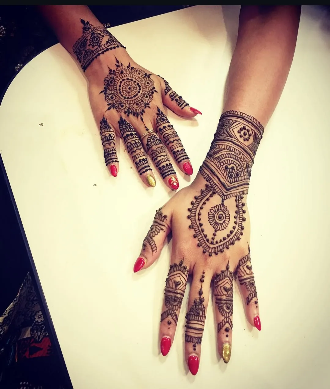 Arabic floral design flowing up the forearm