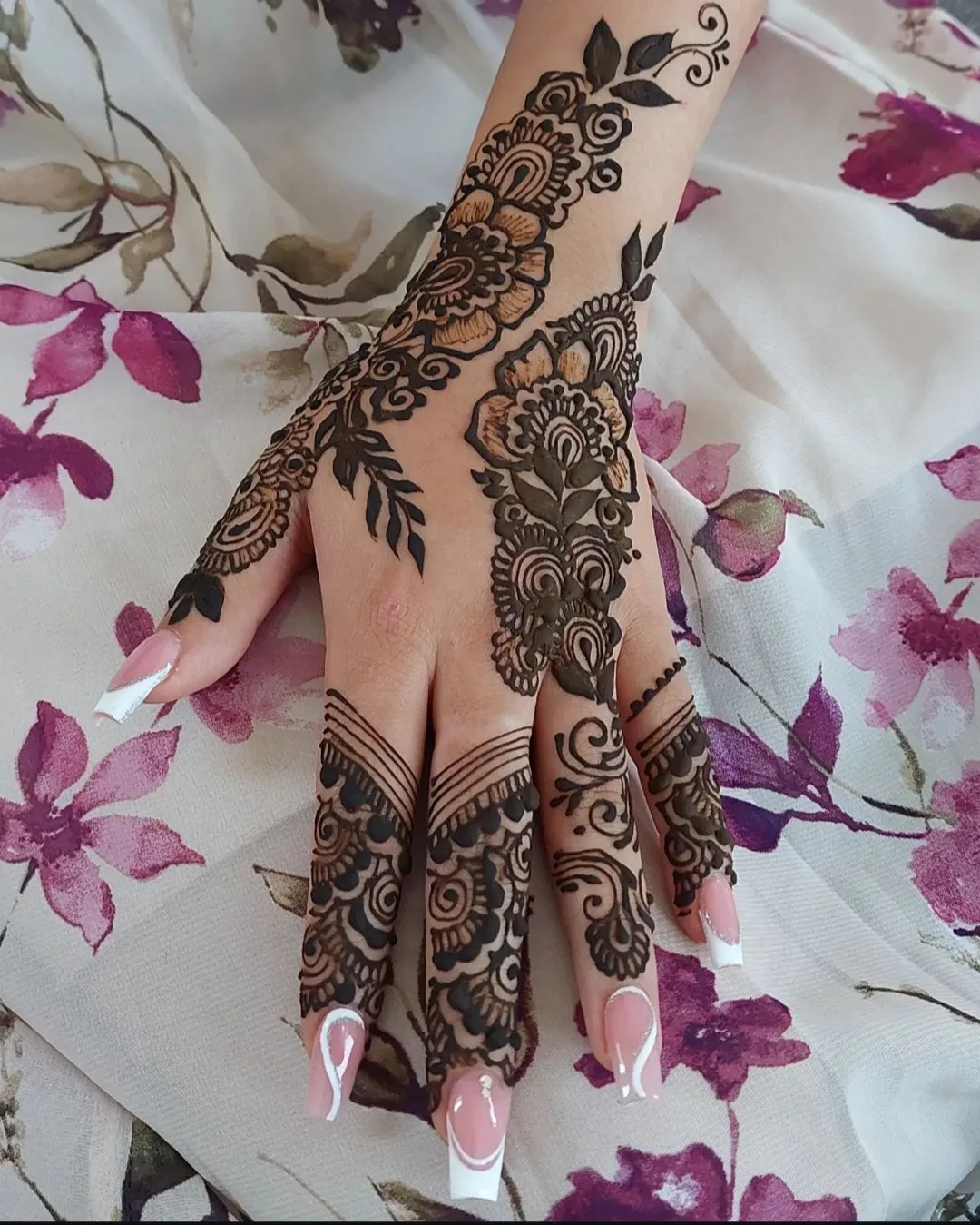 Pakistani bridal mehndi with dense jali detail on the hands