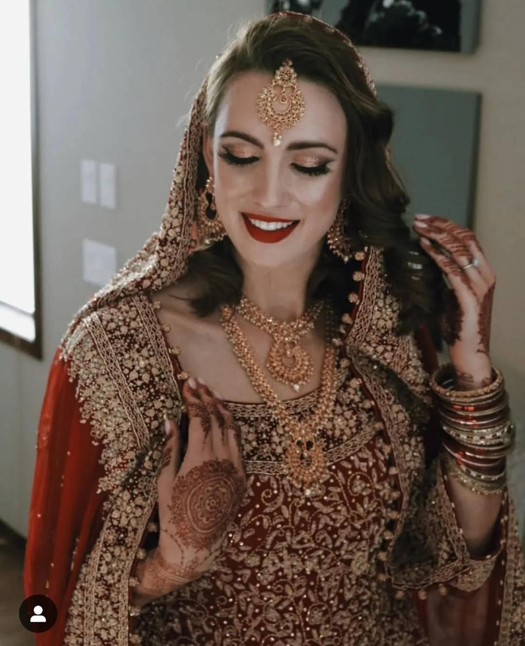 Bride showing her completed bridal henna