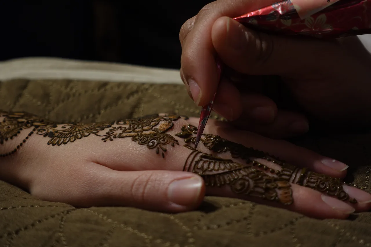 Completed intricate bridal mehndi design on a bride's hands