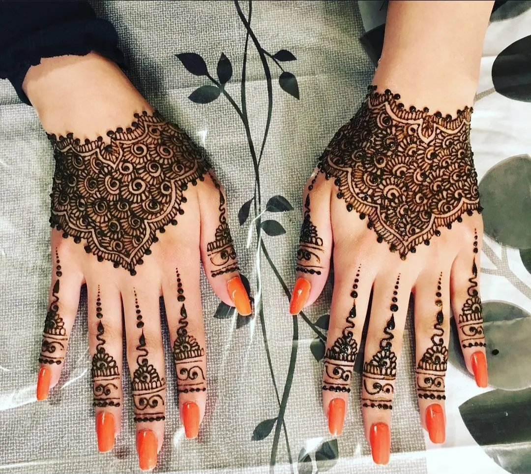 A palm showing a deep henna stain, illustrating how palms hold colour darkest